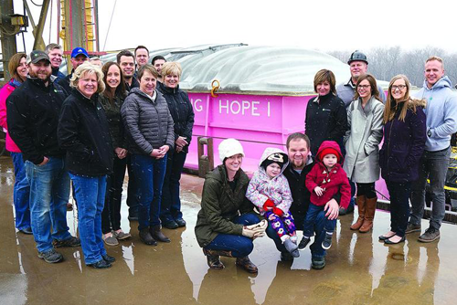 Marquis Energy Staff Members pose in front of Big Hope 1