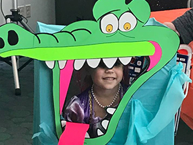 little girl in crocodile photobooth