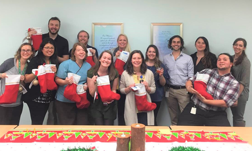 Mary Crowley Team holding stockings stuffed for Medical City Dallas oncology patients