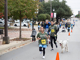 Mary Crowley Cancer Research runners through downtown Arlington, Tx