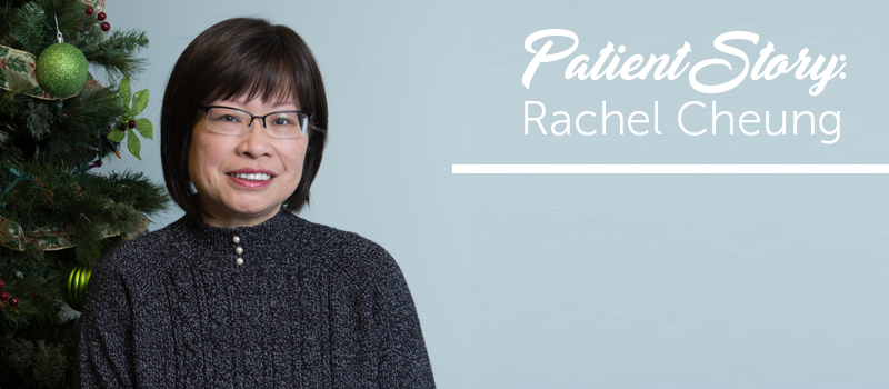 Patient Rachel Cheung standing next to a Christmas tree