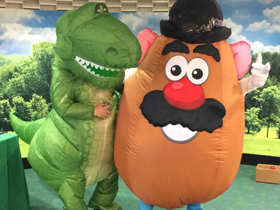 Team members dressed as Rex and Mr. Potato Head